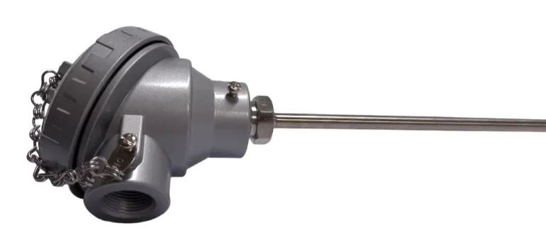 Mineral insulated thermocouple with a large cast terminal head and chained cap